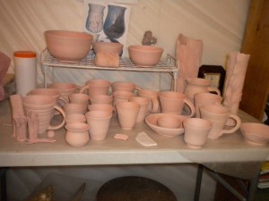 Bisqued pottery pieces waiting to be glazed.